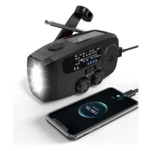 Emergency radio charging a smartphone with flashlight.