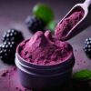 A container of purple powder is being held by a spoon.