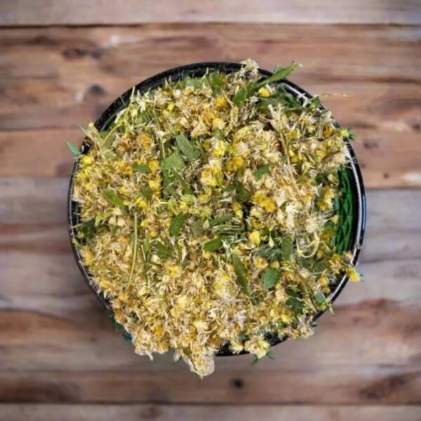 A bowl of corn and other vegetables on top of a table.