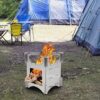 A fire pit is set up in the middle of an outdoor area.